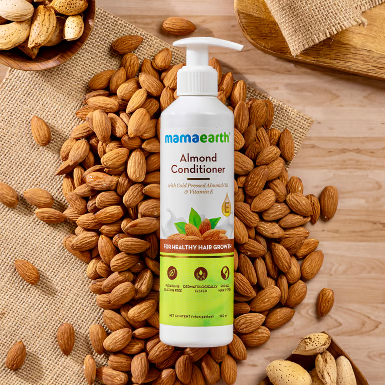 Mamaearth Almond conditioner with almond over sack