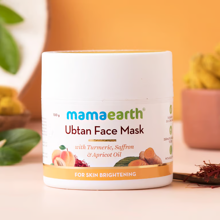 Mamaearth ubtan face mask with orange background